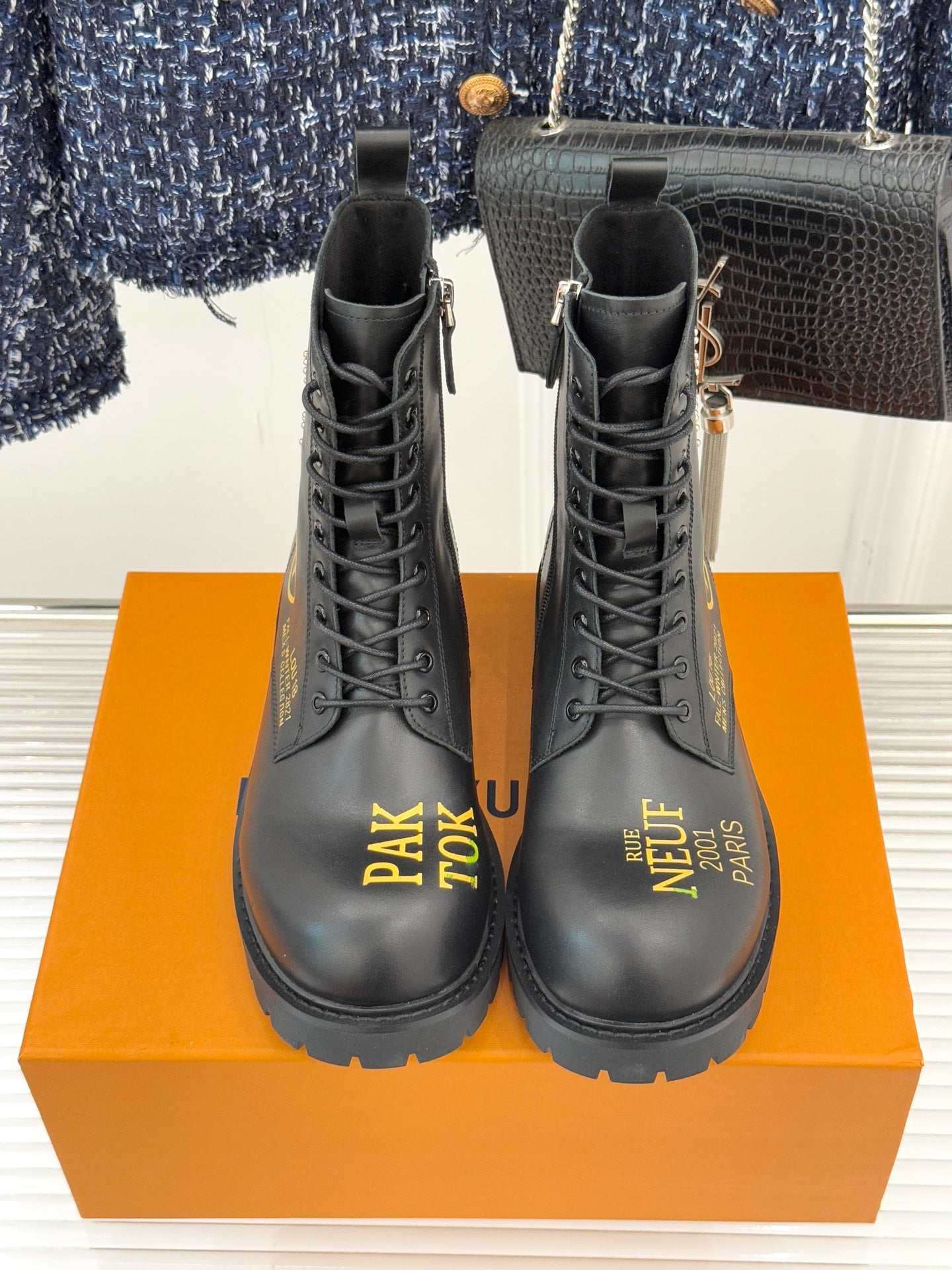 Louis Vuitton ladies lace-up ankle boots, black leather, front view, gold zipper pull
