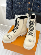 Louis Vuitton ladies ankle boots pair, cream leather, black lace-up front and rugged sole