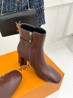 Brown ankle boots with square buckle strap and side zipper on block heel