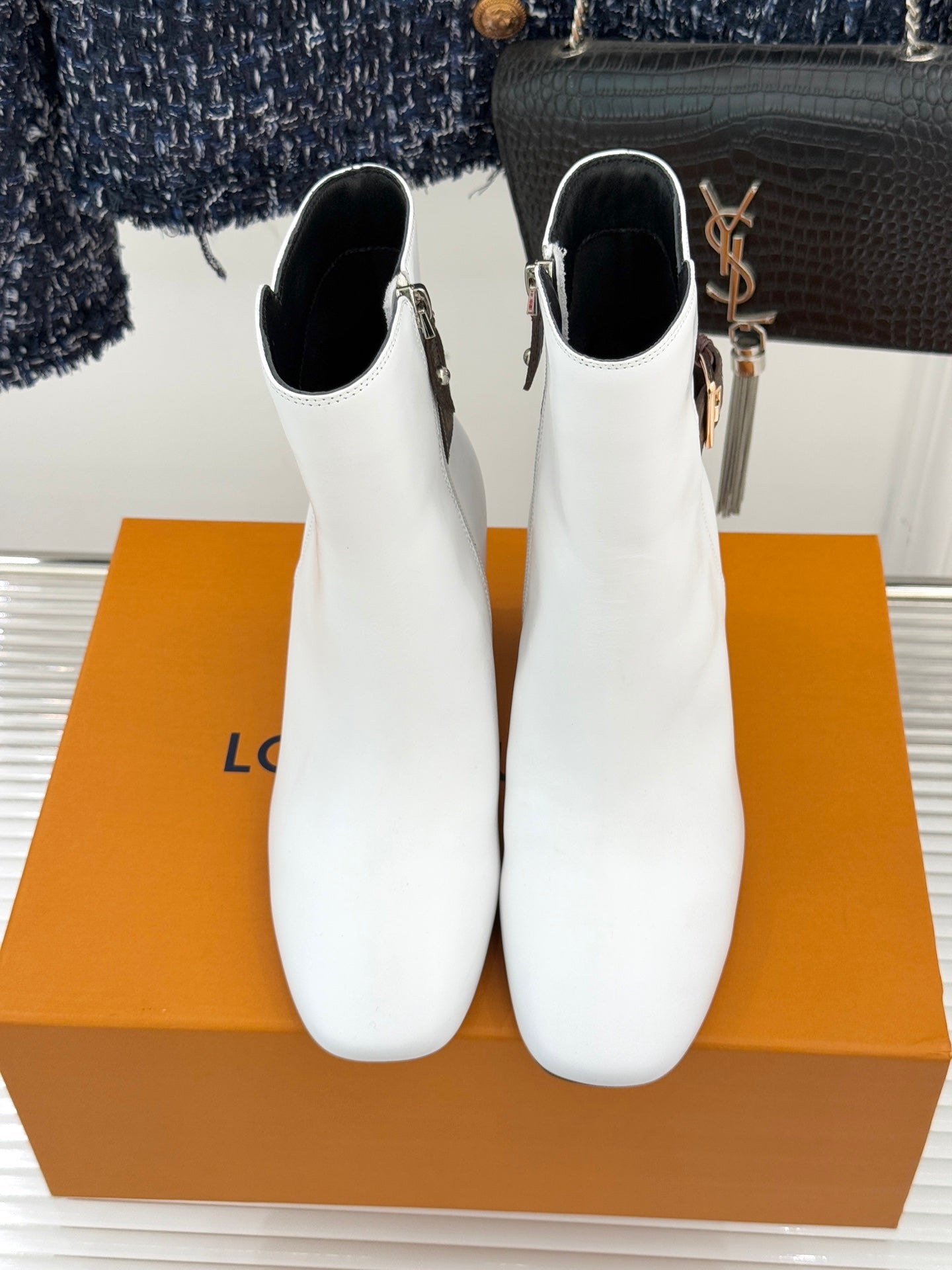 Louis Vuitton ladies white ankle boots pair with side zipper and brown monogram trim