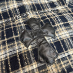Cross applique detail on long plaid shirt with stitched decorative border