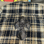 Long plaid shirt back with dark cross applique and embroidered trim detail