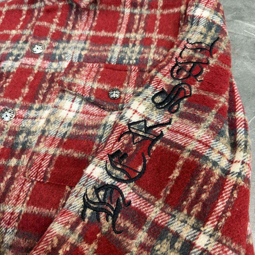 Red plaid coat with embroidered black graphic and snap buttons