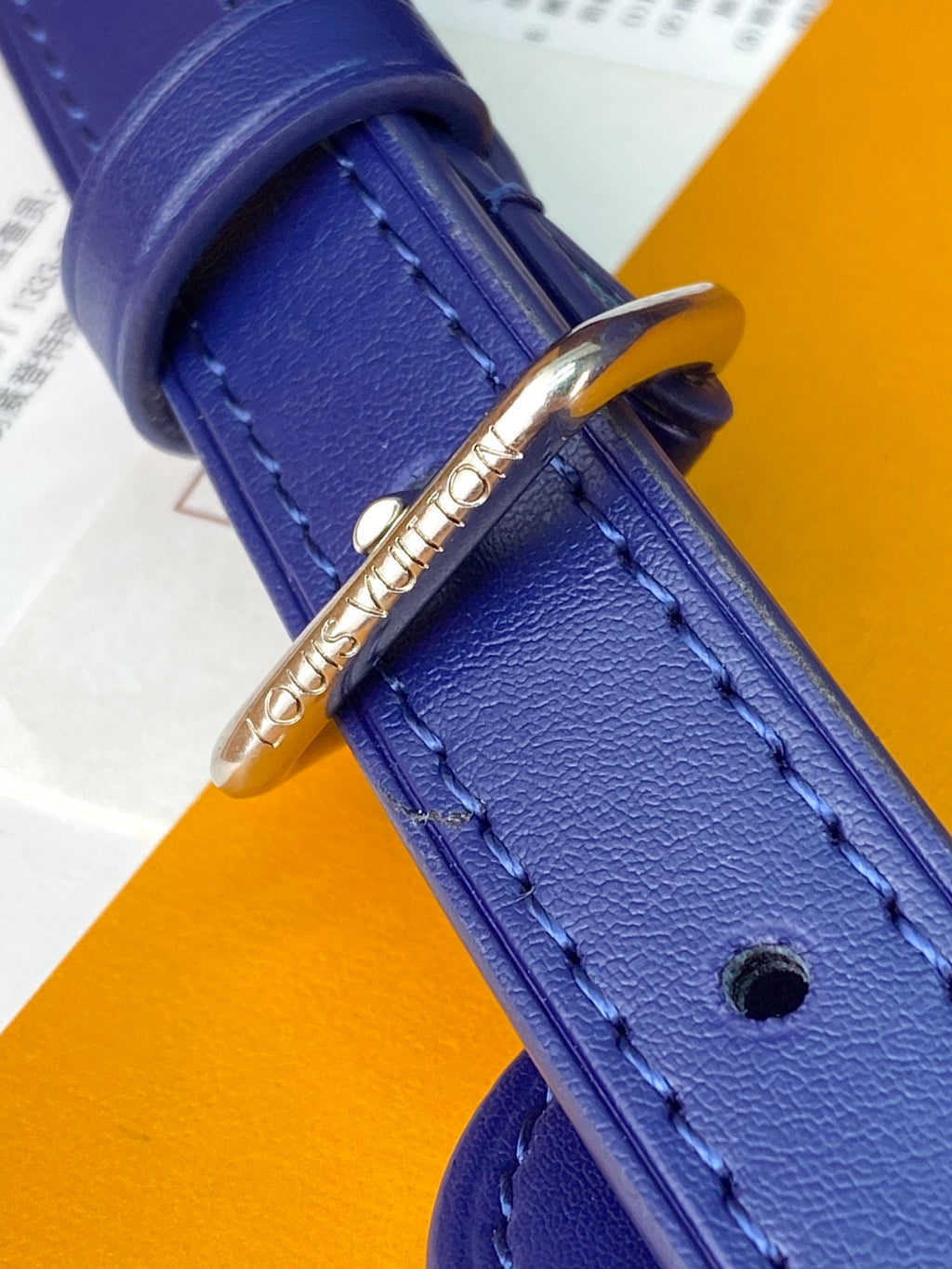 Men's Louis Vuitton bag blue leather strap corner with gold hardware and stitching