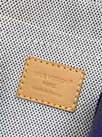 Louis Vuitton Paris leather label on blue textured monogram crossbody bag