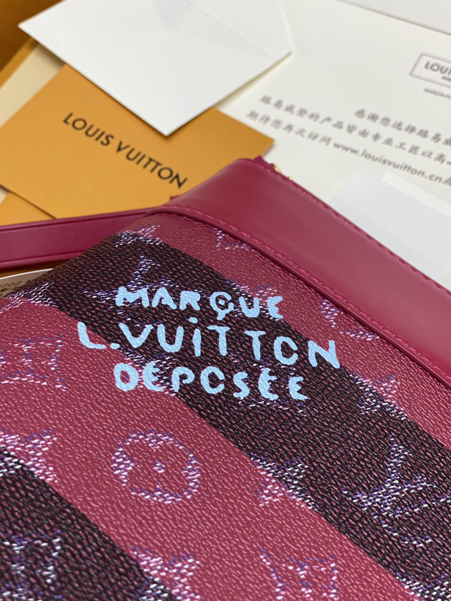 Louis Vuitton small bag, dark pink leather with monogram pattern and logo patch
