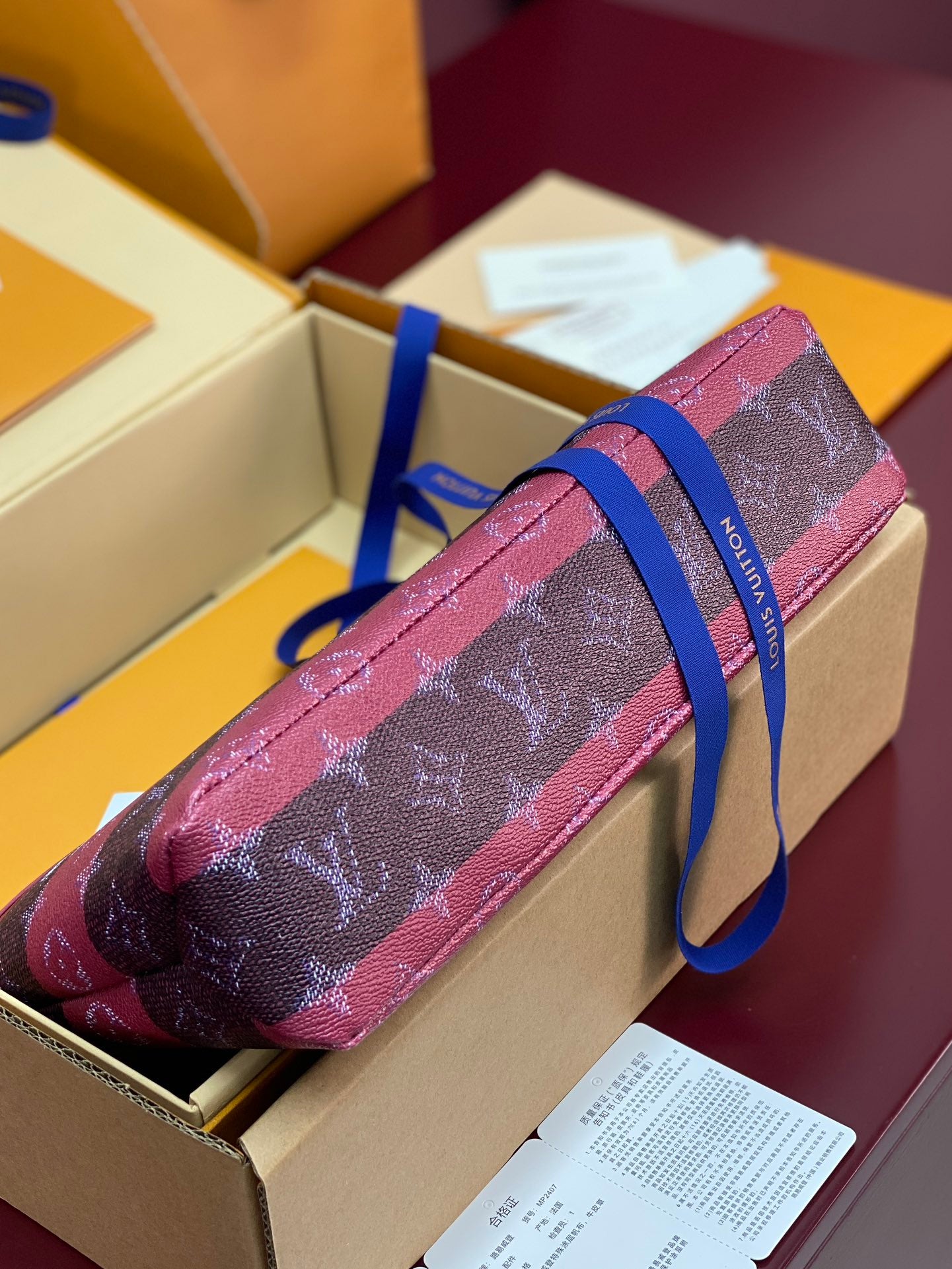 Louis Vuitton small bag, pink monogram canvas with blue shoulder strap and zipper