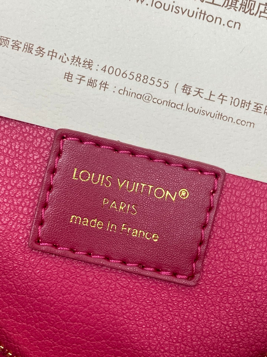 Louis Vuitton small bag leather label patch in pink with “PARIS” text