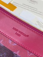 Louis Vuitton small bag front label, pink logo text under top zipper trim