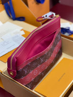 Louis Vuitton small bag side view, pink monogram canvas with blue strap and zipper