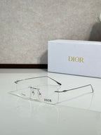 Dior eyeglasses with clear frames and gold-tone bridge