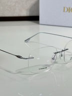 Dior eyeglasses close-up with TITANIUM label and thin metal bridge