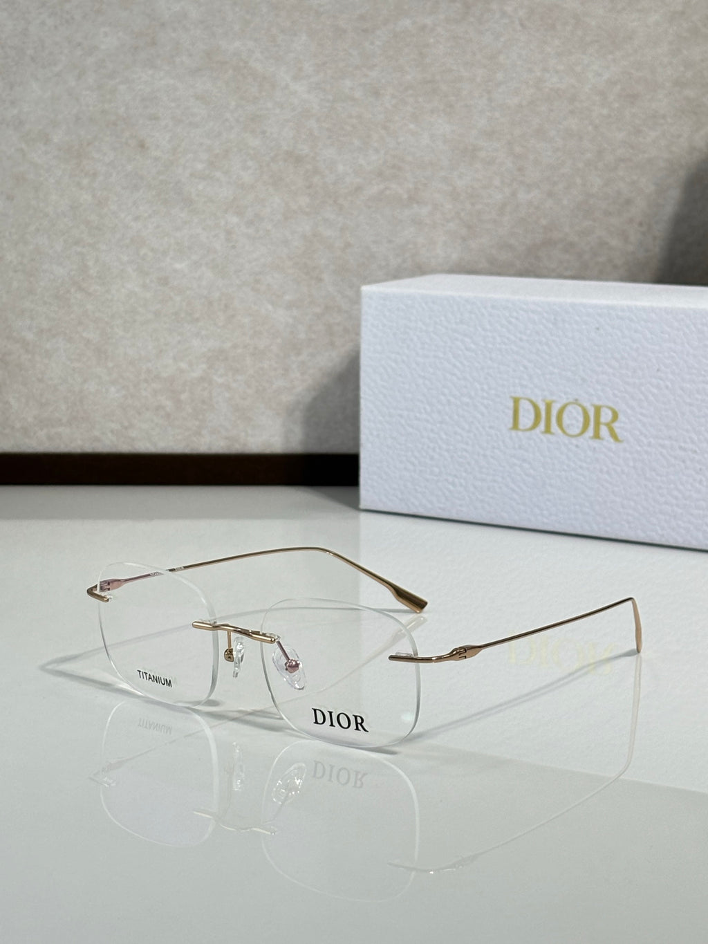 Dior eyeglasses, front view with clear lenses and gold-tone temple tips