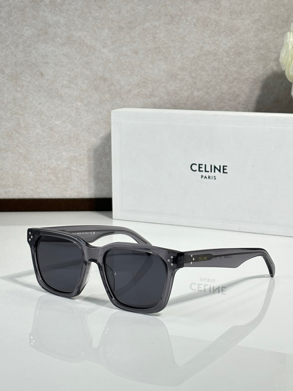 Celine glasses with dark gray rectangular frames and dark tinted lenses
