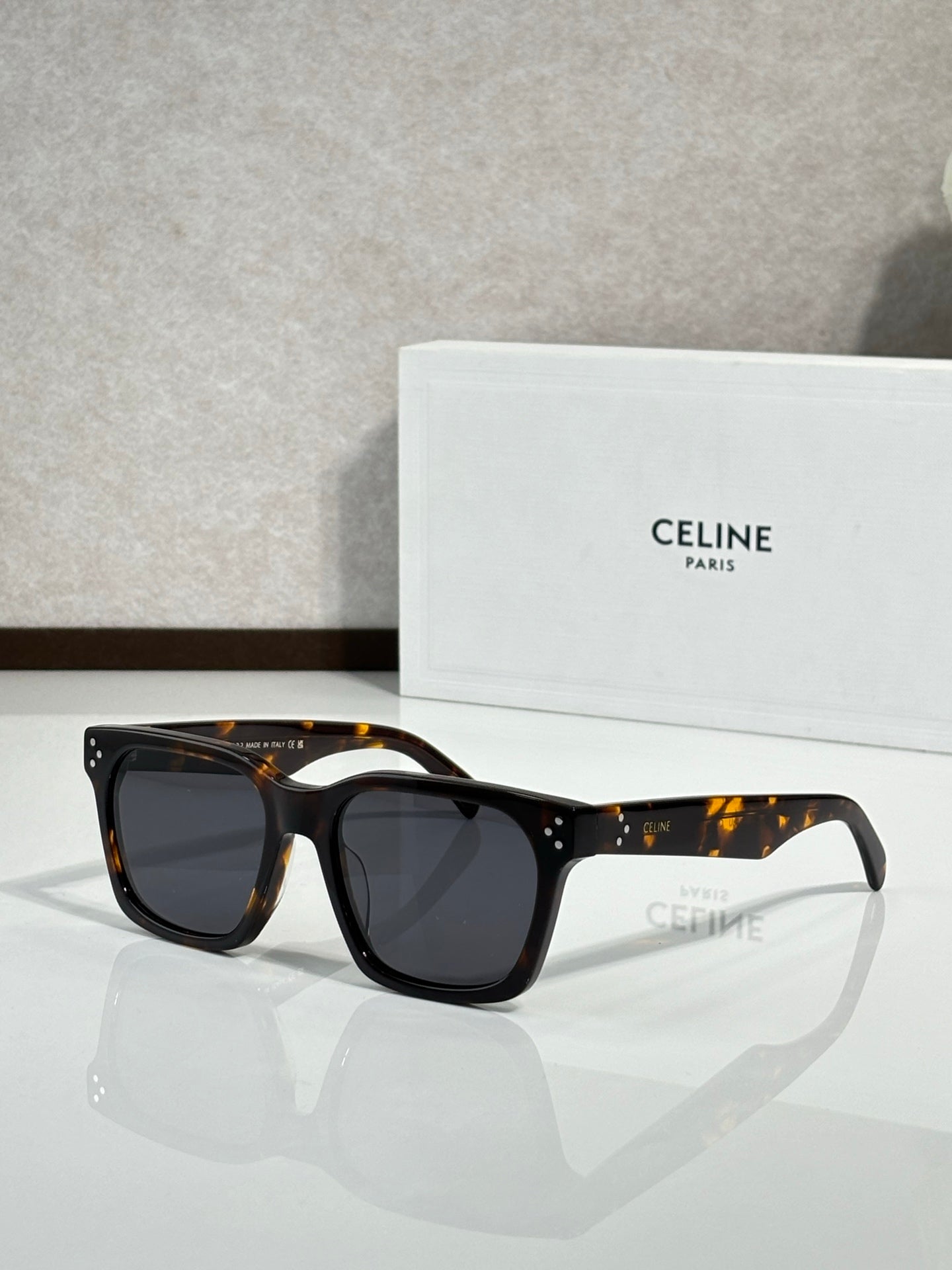 Celine glasses with dark tortoiseshell rectangular frames and dark tinted lenses