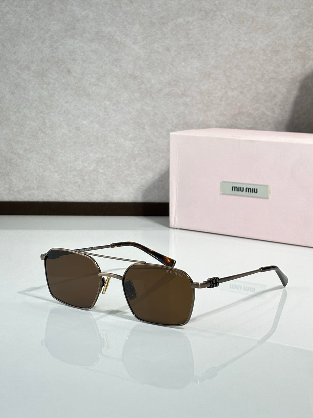 MiuMiu sunglasses, gold metal with dark brown lenses and clear temple arms