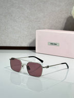 MiuMiu sunglasses, silver metal with rose-tinted lenses and black temple arms