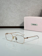 Rose-gold rectangular eyeglasses with clear lenses and metal temples