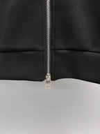 Fendi black sweatshirt close-up of zipper and seam at mid torso