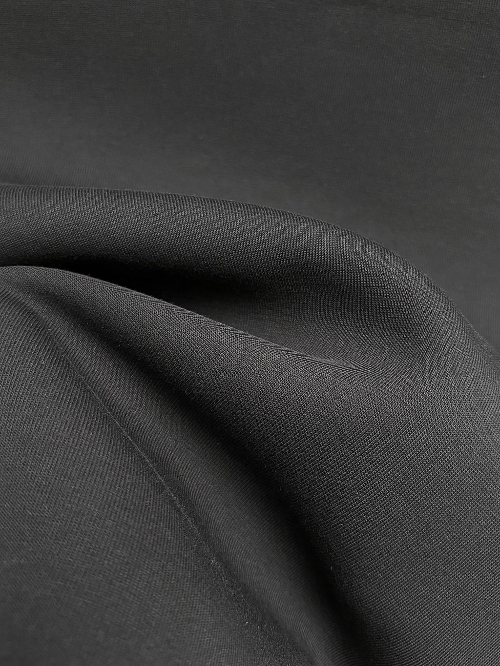 Fendi black sweatshirt fabric close-up with subtle textured weave