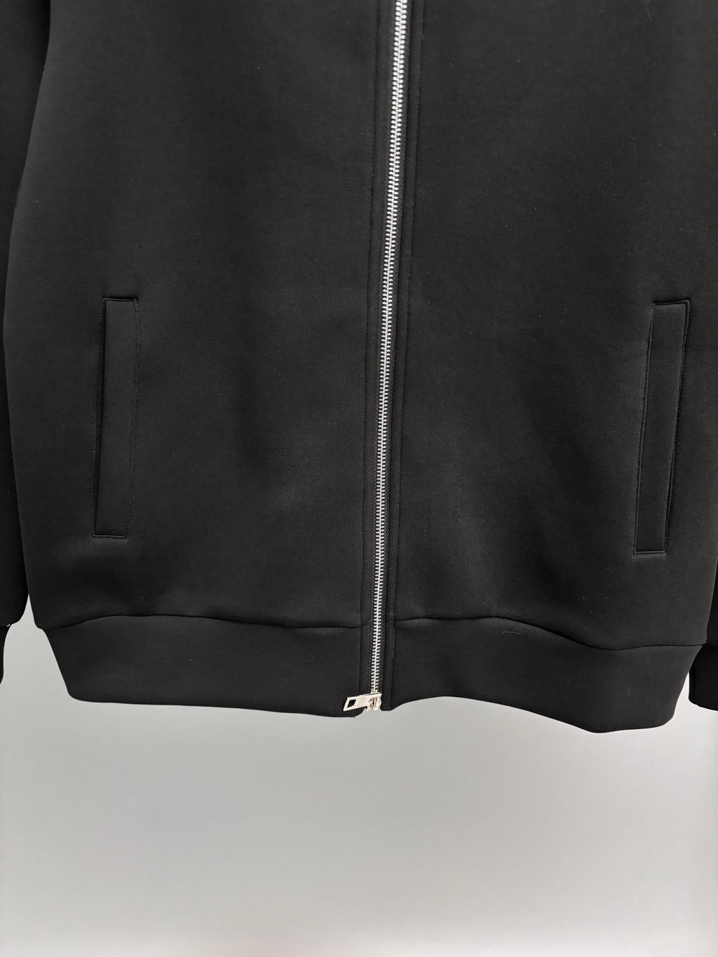 Fendi black zip-up sweatshirt front hem with pockets and centered zipper