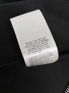 Fendi black garment label on black fabric
