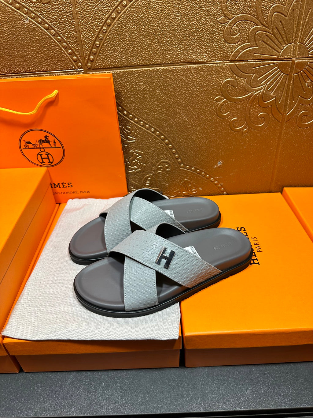 Hermes slide sandals, crossed straps with embossed texture and black H detail