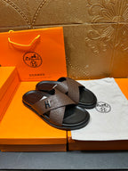 Brown textured slide sandals with black footbed and H logo strap