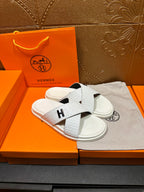 Hermes white slide sandals, black H logo cross straps over white sole