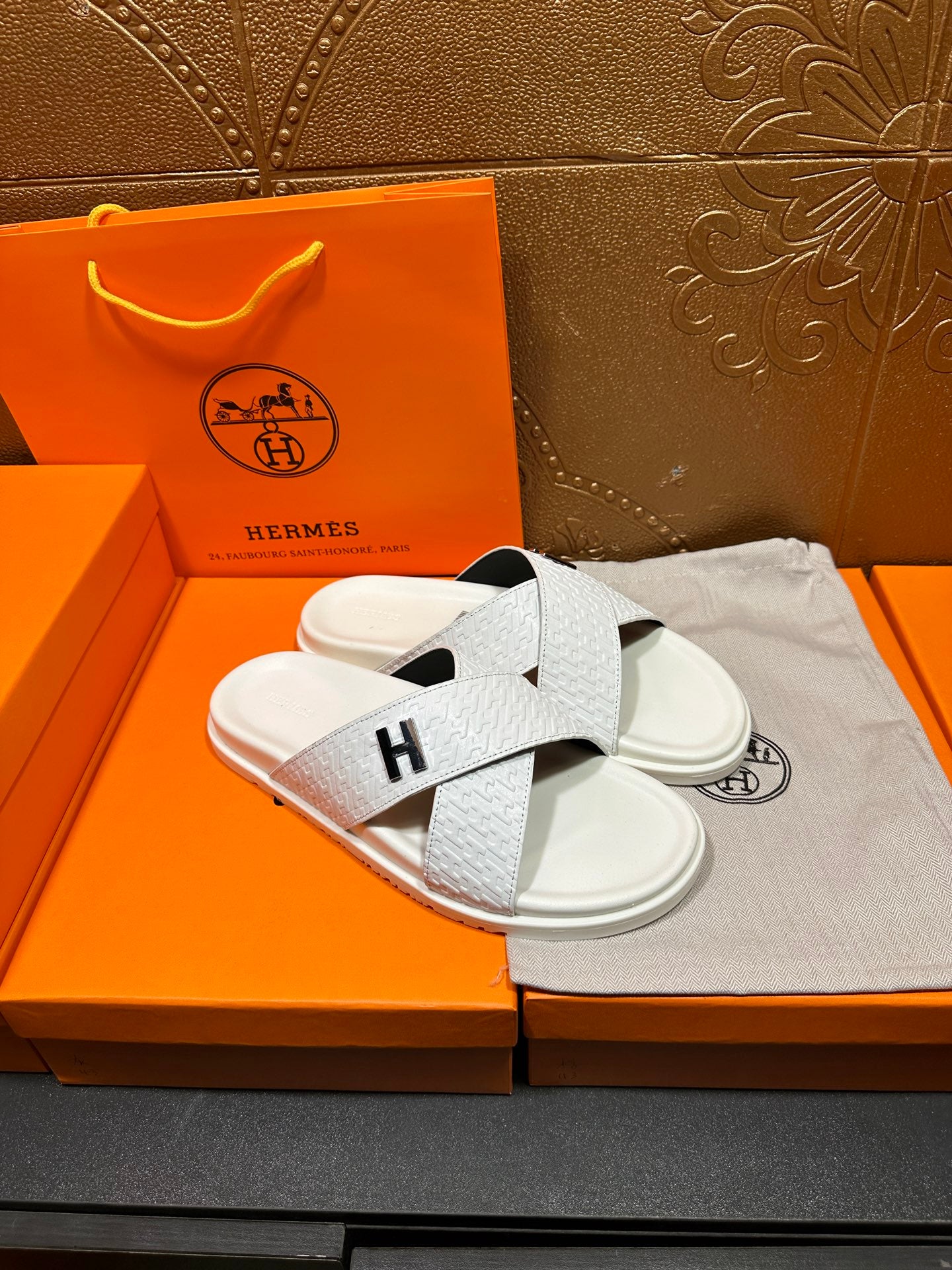 Hermes white slide sandals, black H logo cross straps over white sole
