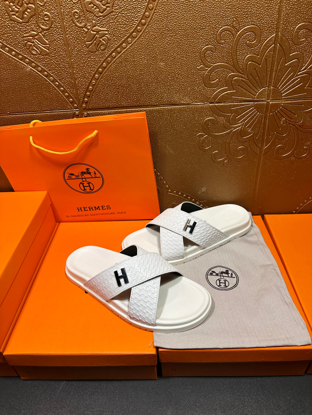 Hermes white leather slide sandals with black H logo on crossed straps