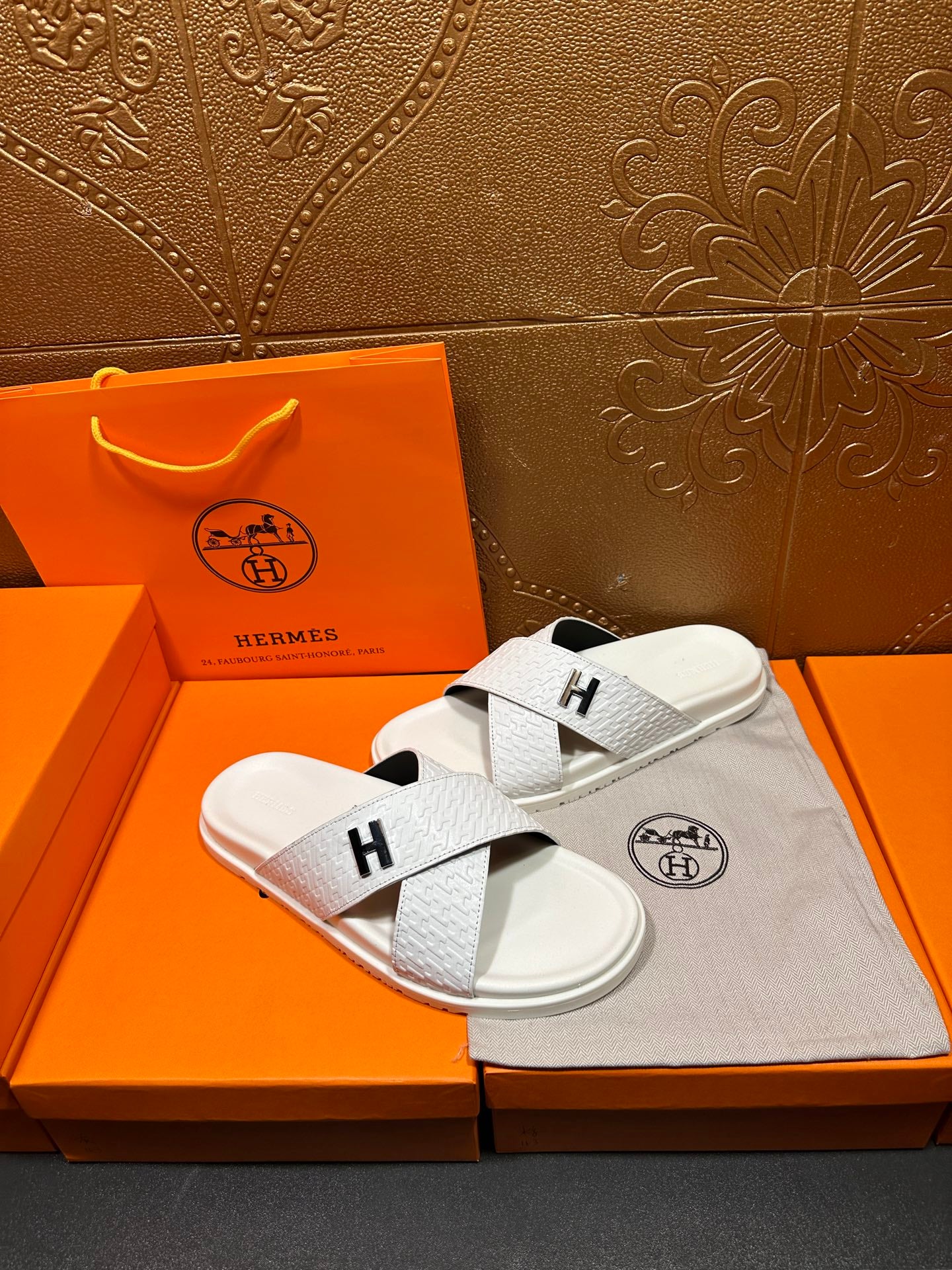 Hermes white leather slide sandals with black H logo on crossed straps