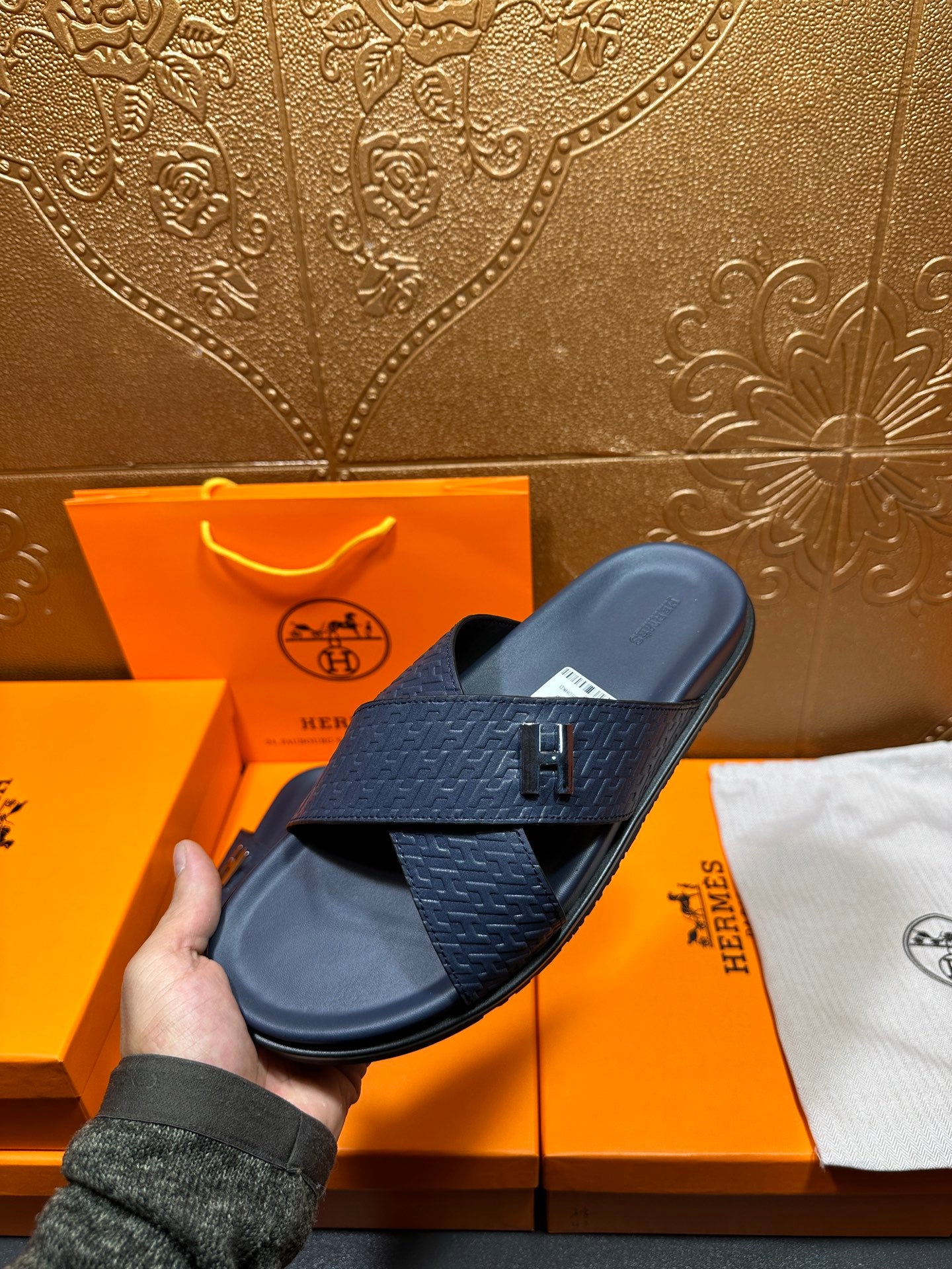 Navy textured slide sandals with H logo buckle on front cross strap