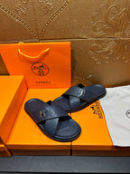 Navy textured slide sandals with H logo buckle and open toe straps
