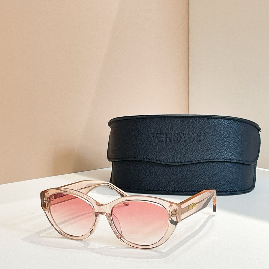 Versace sunglasses with translucent rose frames and pink lenses