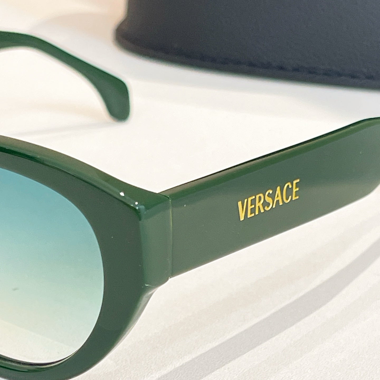 Versace sunglasses green temples with gold VERSACE logo detail