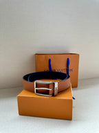 Louis Vuitton leather belt with tan strap and silver-tone buckle