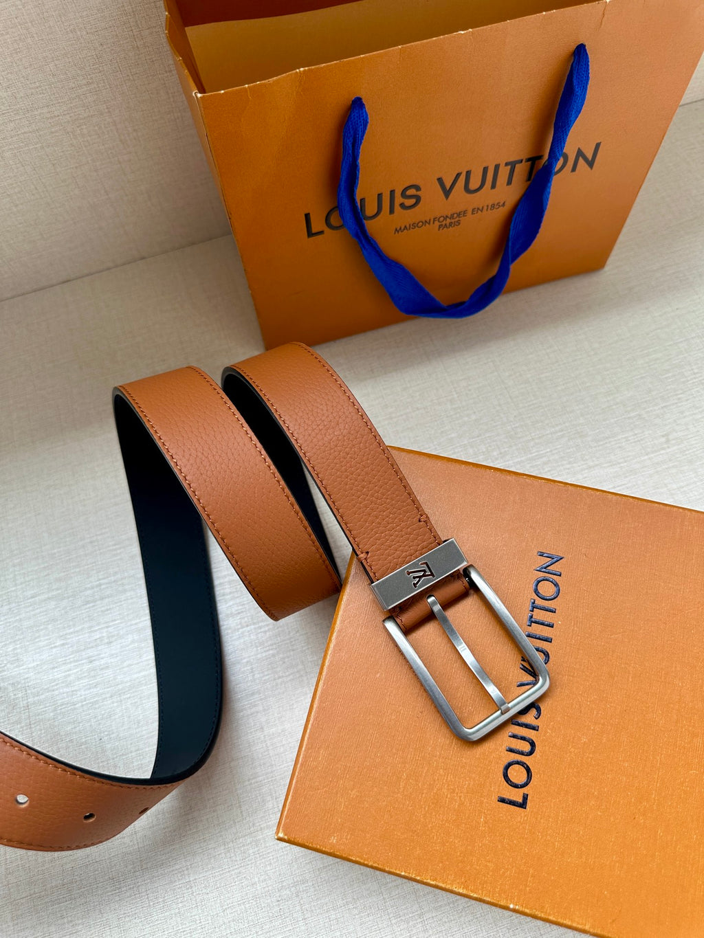 Louis Vuitton leather belt with tan straps and silver-tone rectangular buckle