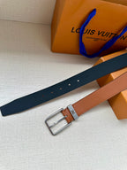 Louis Vuitton leather belt with dark navy strap, tan panel, and silver buckle