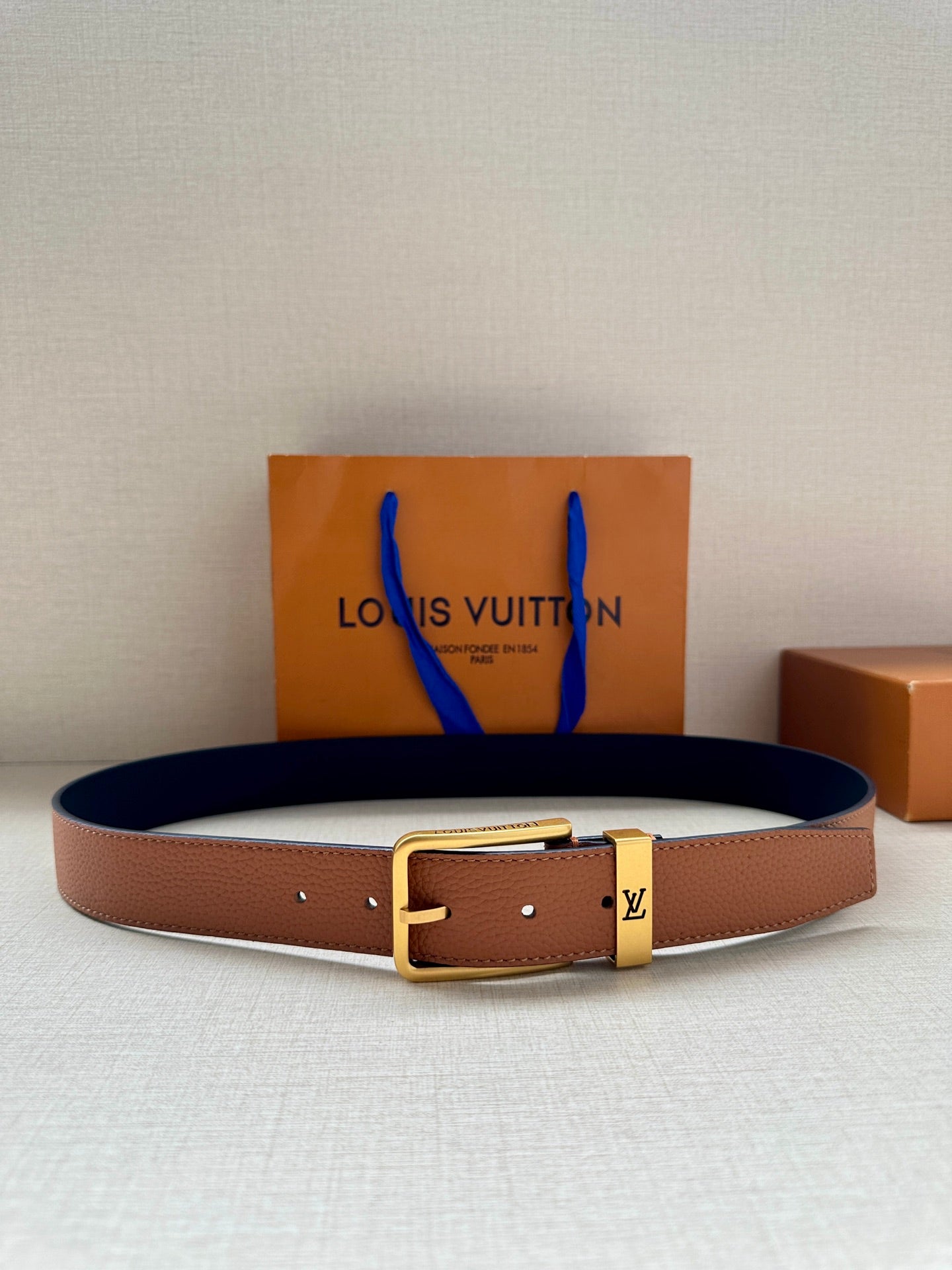 Louis Vuitton leather belt with tan strap and gold-tone buckle