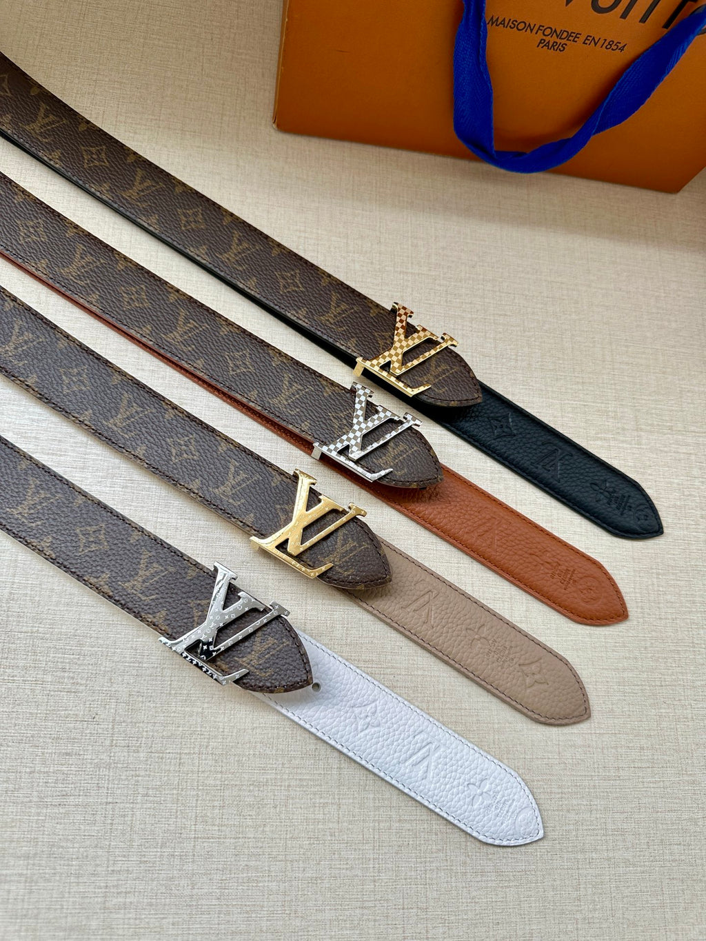 Leather belt set with LV buckle in dark blue, brown, beige, and light gray