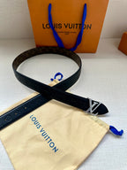 Dark blue leather belt with LV buckle and monogram pattern, crossed strap view