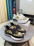 Designer sneakers set: white and black with gold medallion and baroque motifs, lace-up.