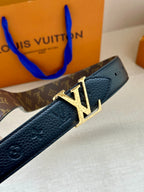 Monogram belt strap close-up with textured leather and gold-tone LV buckle