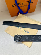 Louis Vuitton belt strap with dark monogram leather and silver buckle on blue edge