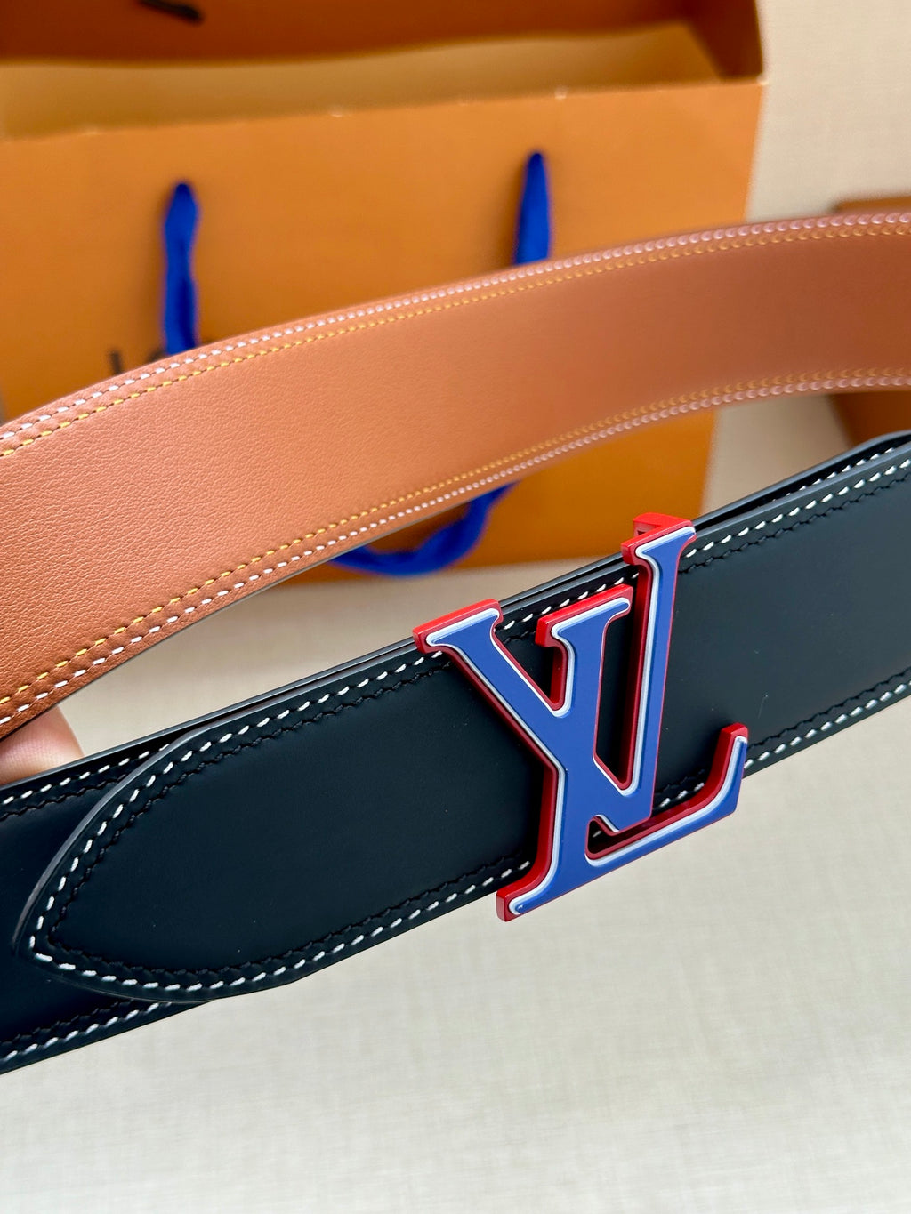 Dark blue leather belt strap with LV monogram buckle, red/blue outline