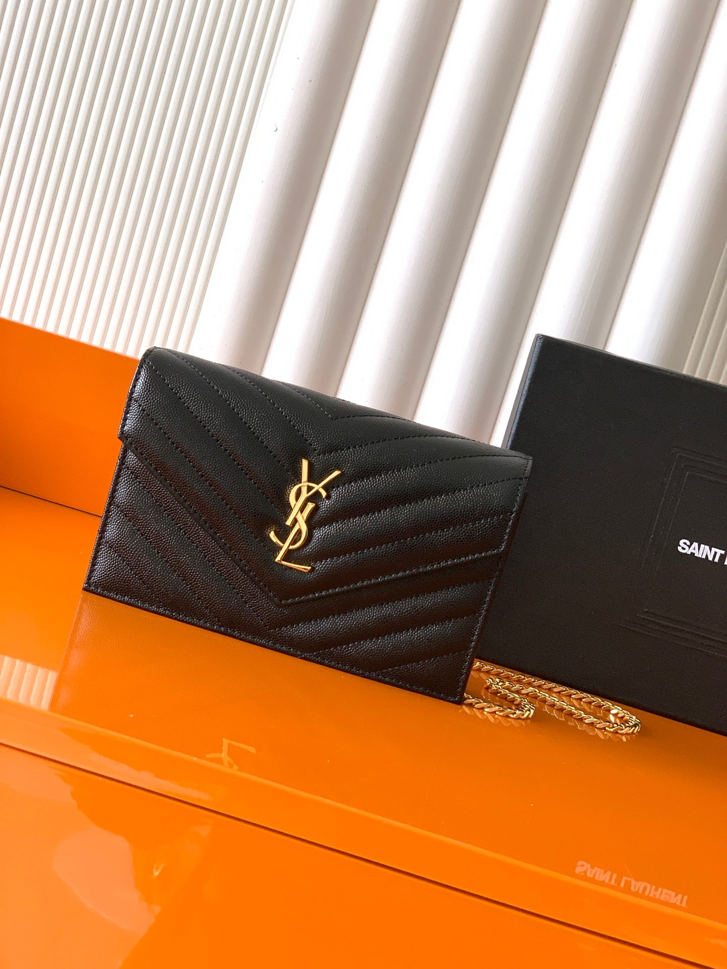 YSL small black quilted shoulder bag with flap, gold YSL logo and chain strap