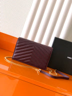 Burgundy YSL crossbody flap bag with gold chain strap and magnetic flap