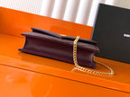 Burgundy flap bag with gold chain strap and stacked layered front design
