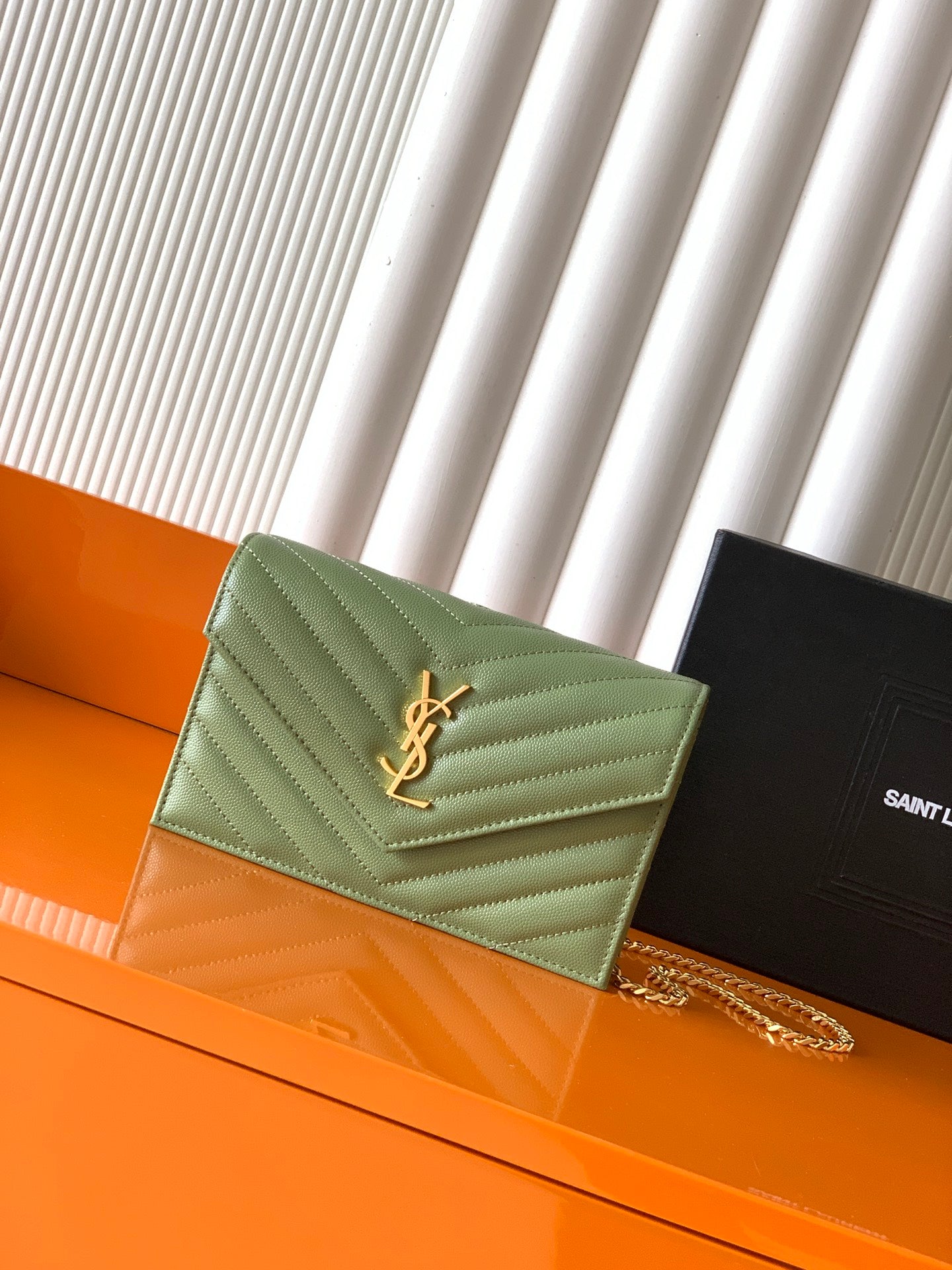 Green quilted YSL shoulder bag with YSL logo and gold chain strap